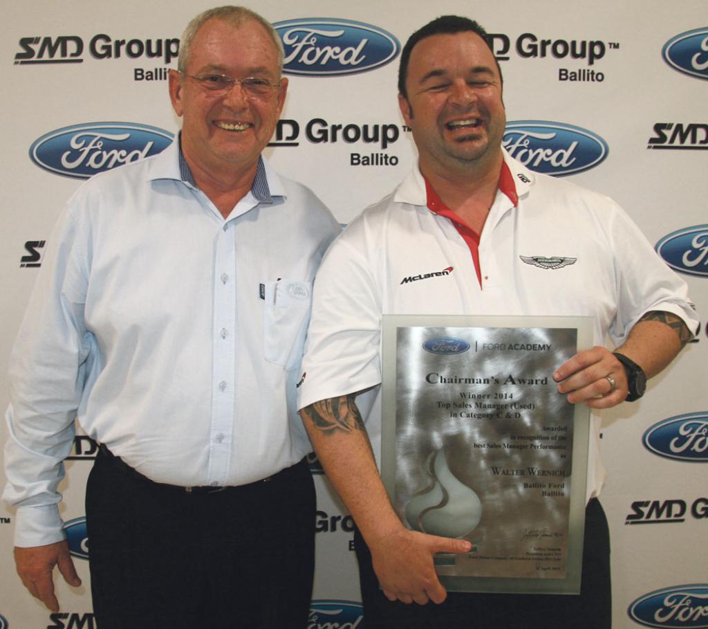 dealer principle ivan hartley presents smd groups ford pre owned sales manager walter wernich with his award for pre owned sales manager of the year 2014
