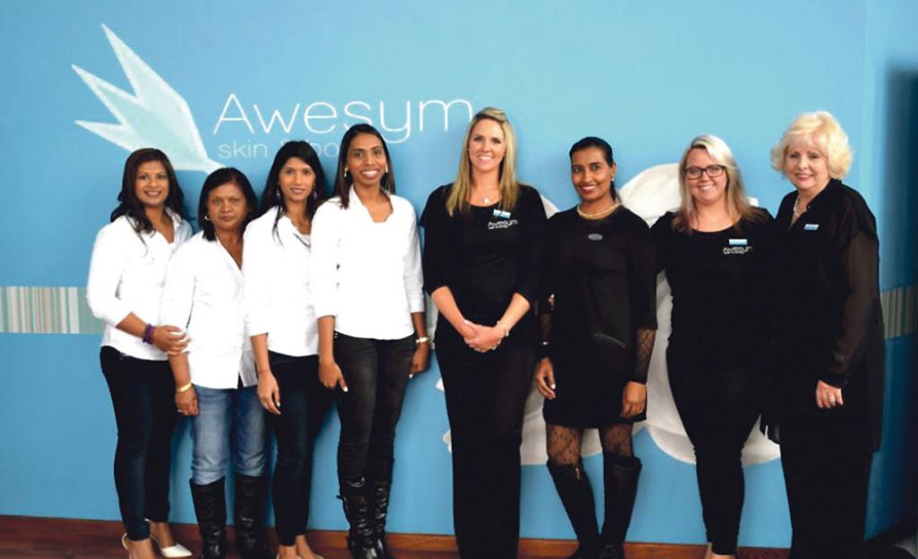 the firming studios team left with their colleagues at awesym skin and body