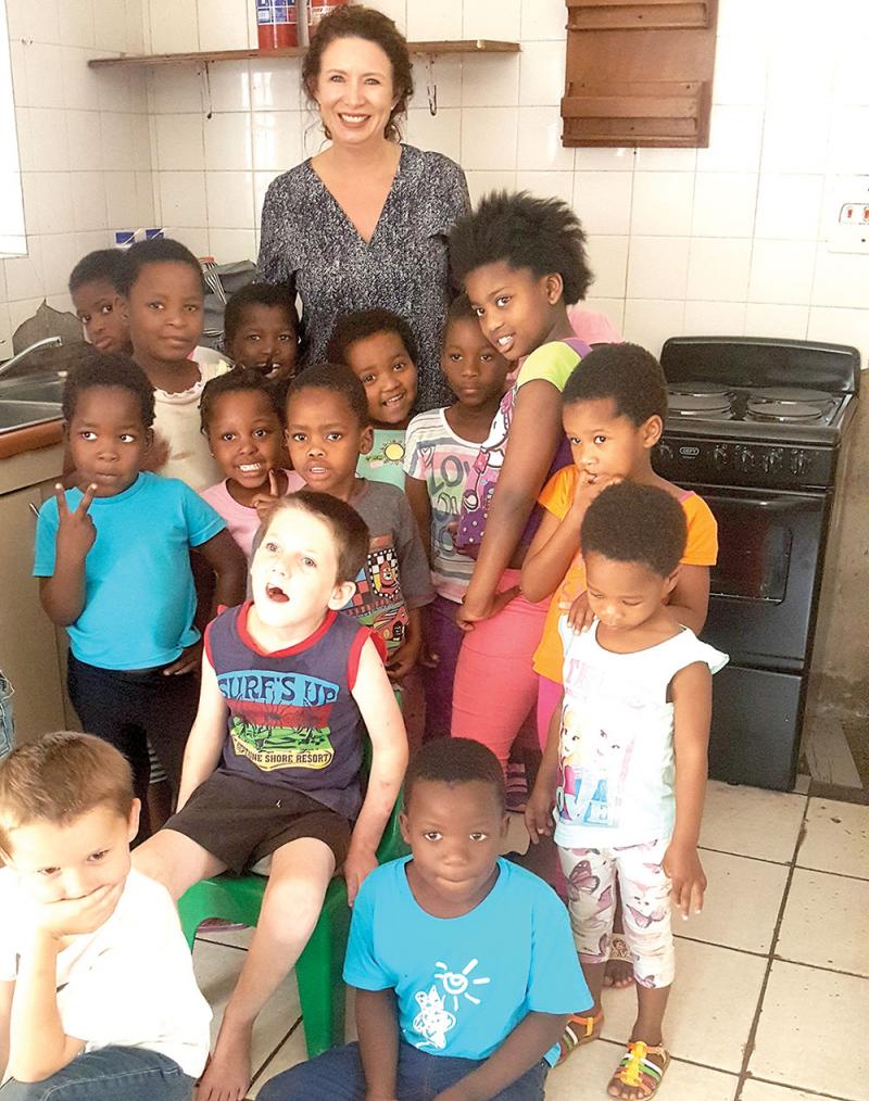 jeanne vogel van der sandt president of umhlanga women achievers with the children from malvern child and youth care centre
