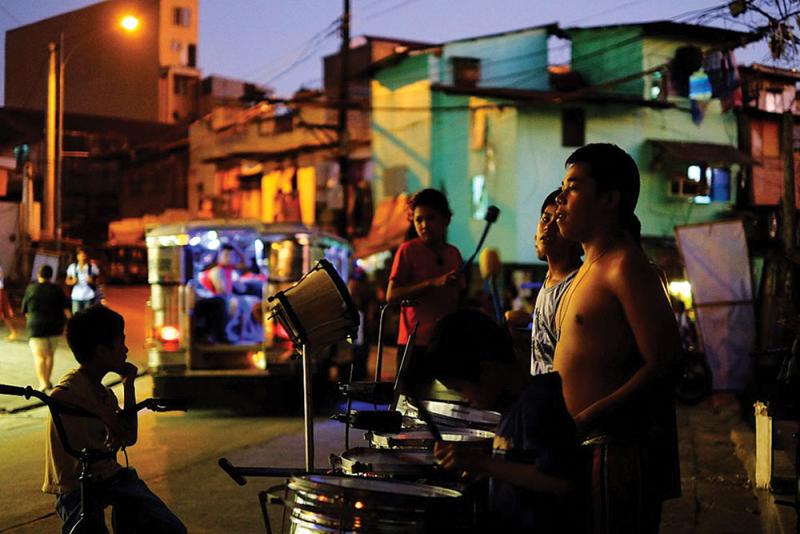 a group of filipinos who call themselves the frisco tribe practice their drum performance in cebu city